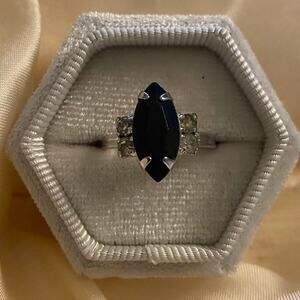 Vintage Sarah Coventry ring features black glass onyx stone in a silver-plated